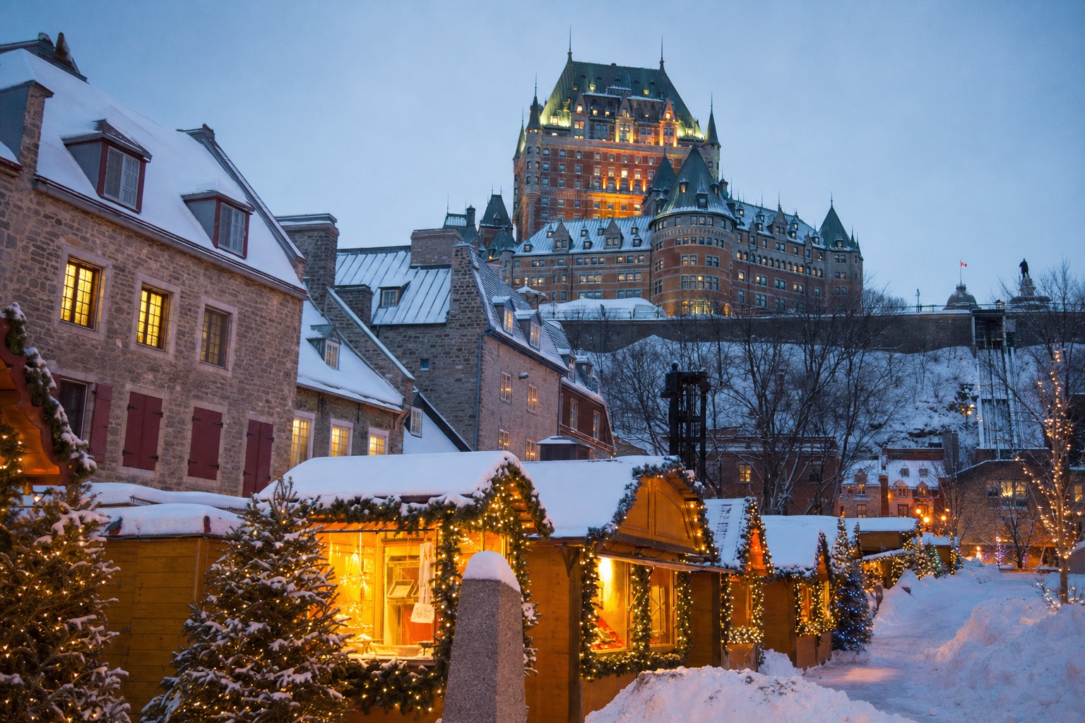 Snowy December evening in Old Quebec with lit Christmas market stalls and garlands under the Château Frontenac