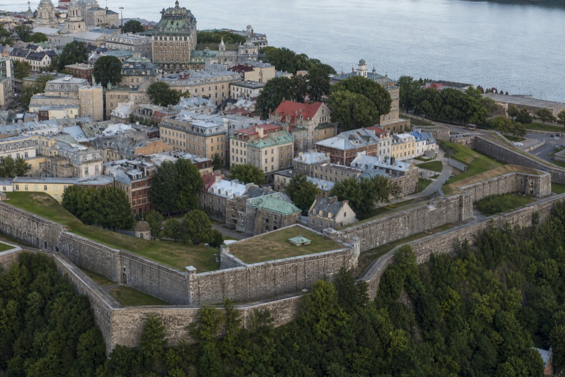 Aerial view of Old Quebec's stone ramparts encircling the upper town rooftops