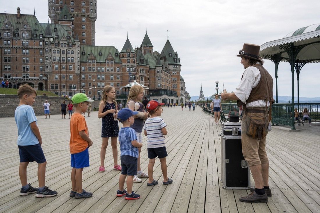 Children watching a street performer near the Château Frontenac on Dufferin Terrace in Quebec City