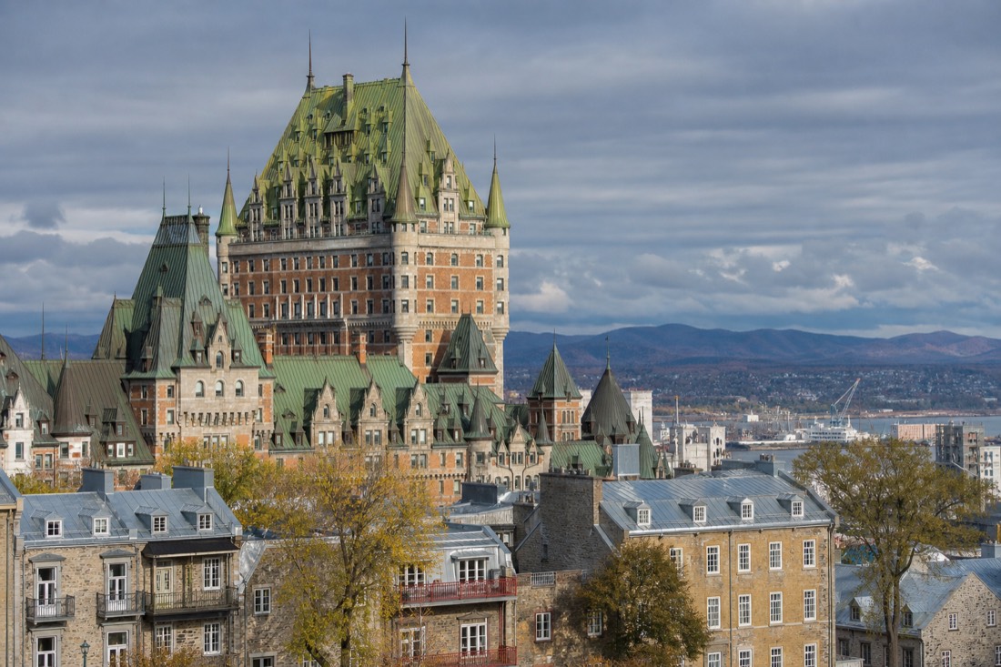 Château Frontenac's green copper roofs and brick towers seen against the skyline of Old Quebec