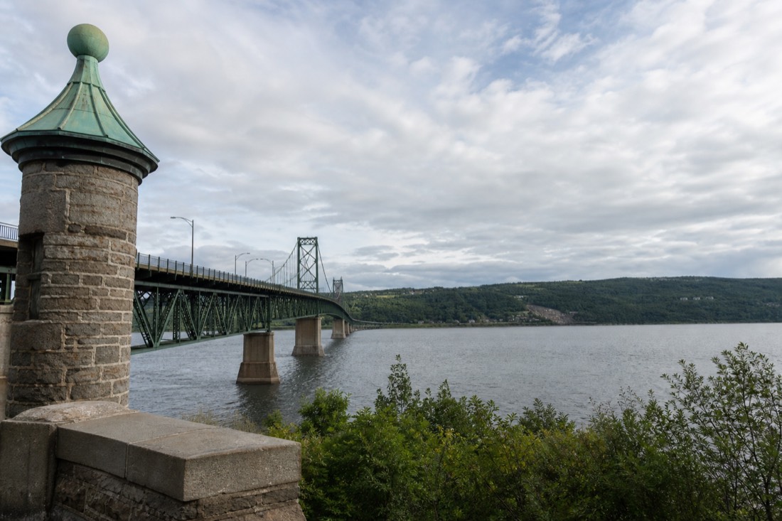 Île d'Orléans bridge crossing the St. Lawrence from the Beauport shore toward the island's green west tip