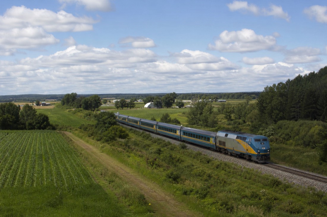 VIA Rail passenger train on the Montreal to Quebec City corridor passing farmland