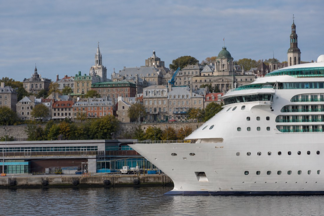 Cruise ship berthed at Wharf 22 in the Old Port of Quebec with Lower Town rooftops behind