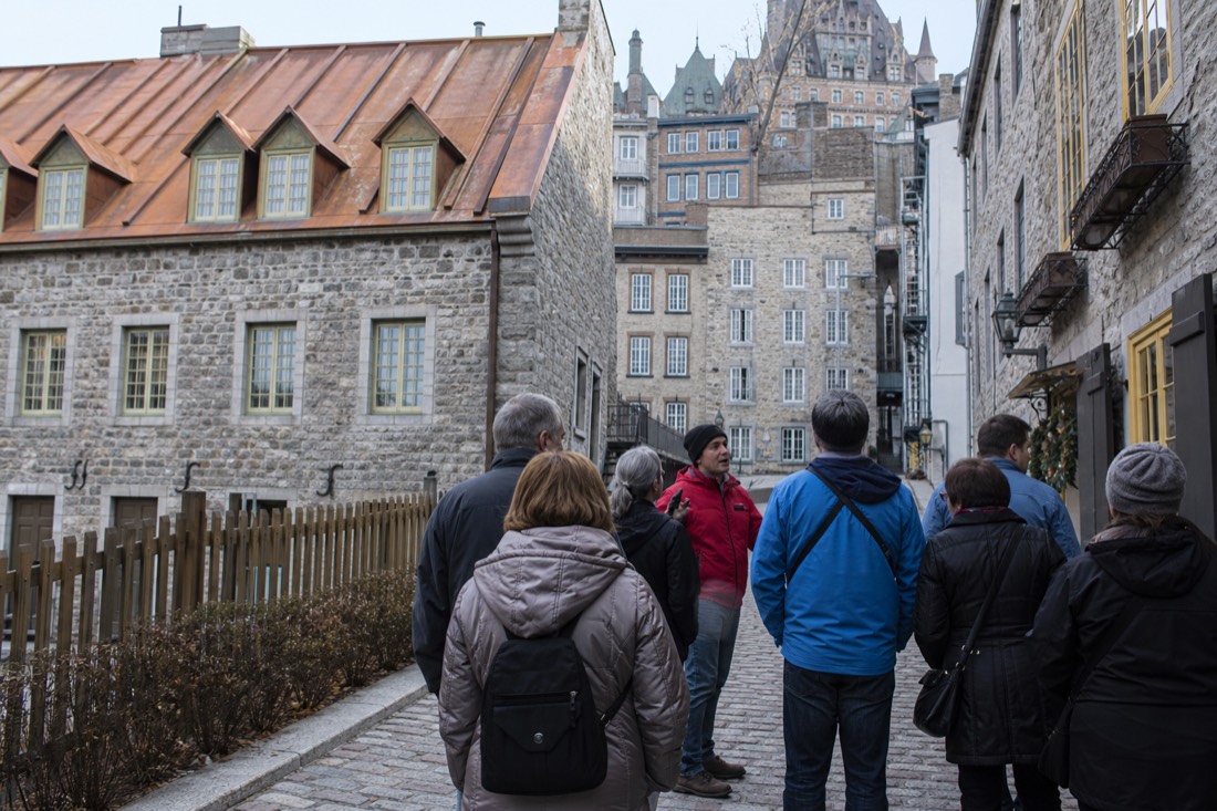 A small walking-tour group on the cobblestones of Quartier Petit Champlain in Old Quebec